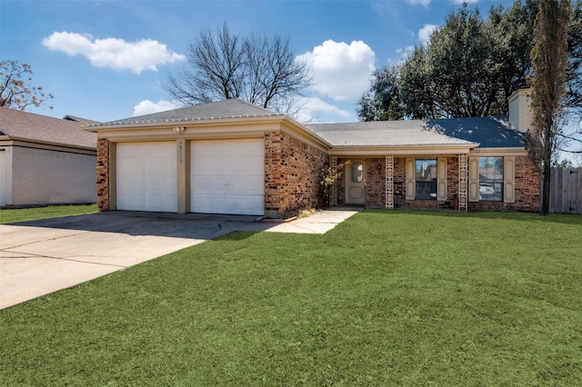 single story home featuring brick siding, a chimney, a front yard, a garage, and driveway