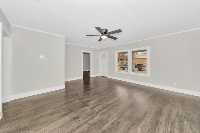 unfurnished living room with dark wood-style floors, ceiling fan, baseboards, and ornamental molding