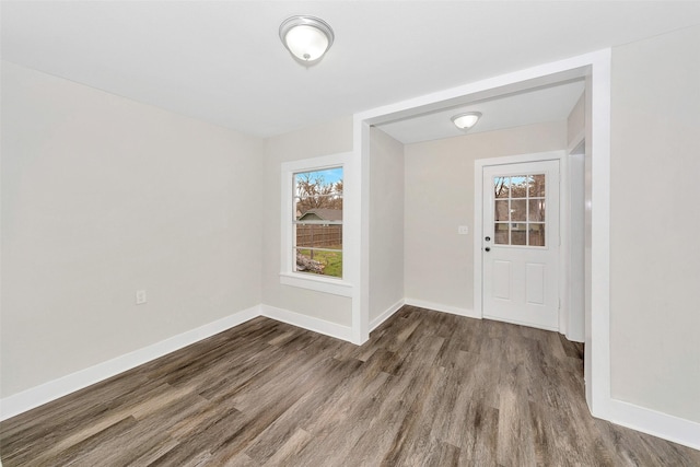 foyer with wood finished floors and baseboards