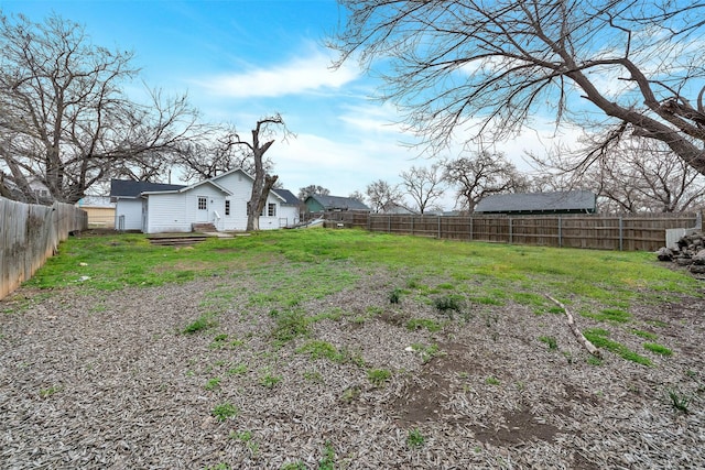 view of yard with a fenced backyard