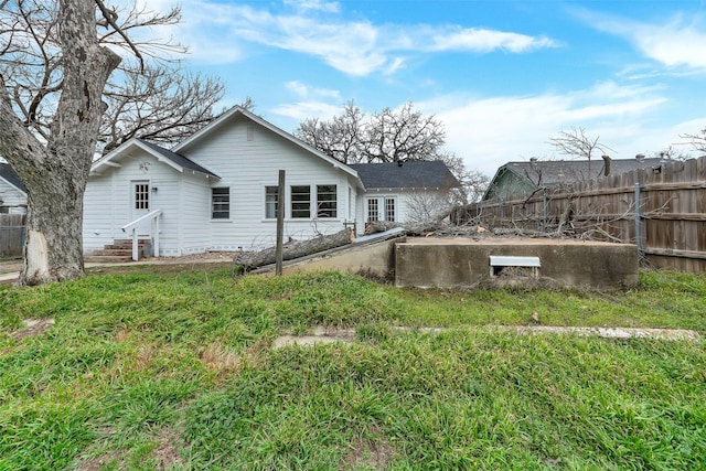 exterior space with entry steps and fence