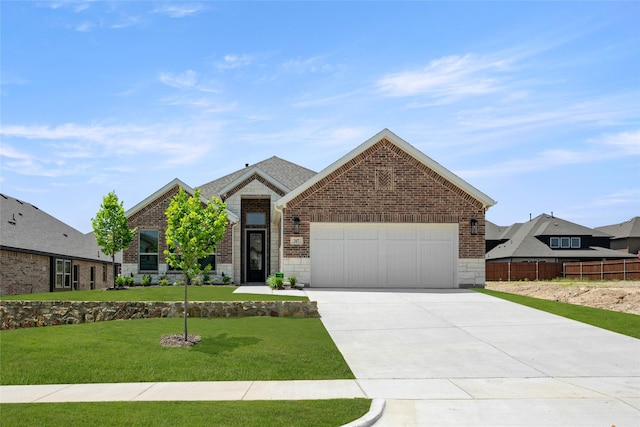 317 Willie Way, Burleson, TX 76028 - view of front of home with a garage, concrete driveway, brick siding, and stone siding