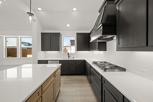 317 Willie Way, Burleson, TX 76028 - kitchen with stainless steel appliances, custom exhaust hood, tasteful backsplash, hanging light fixtures, and a sink