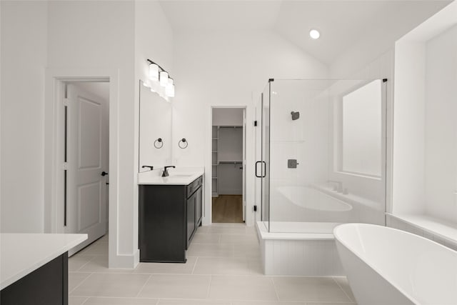 317 Willie Way, Burleson, TX 76028 - full bath with vanity, a freestanding tub, a shower stall, a walk in closet, and tile patterned flooring