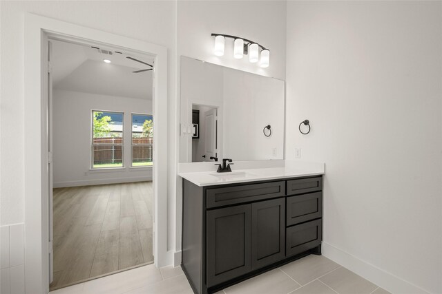 317 Willie Way, Burleson, TX 76028 - bathroom featuring vanity, baseboards, and a ceiling fan