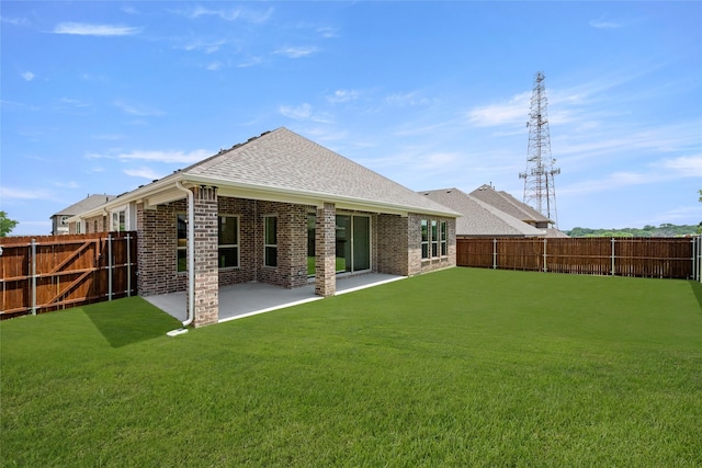 317 Willie Way, Burleson, TX 76028 - rear view of property featuring a shingled roof, brick siding, and a patio