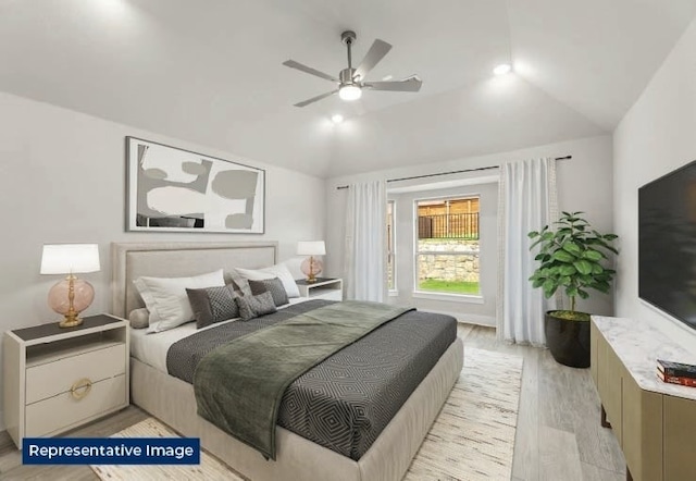 bedroom with a ceiling fan, light wood-style flooring, and lofted ceiling