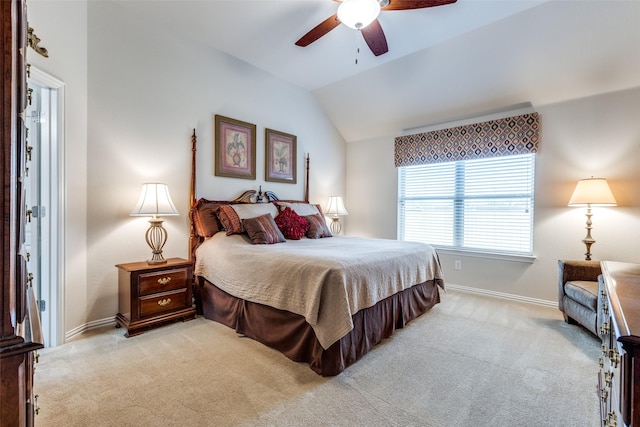 bedroom with a ceiling fan, lofted ceiling, light carpet, and baseboards