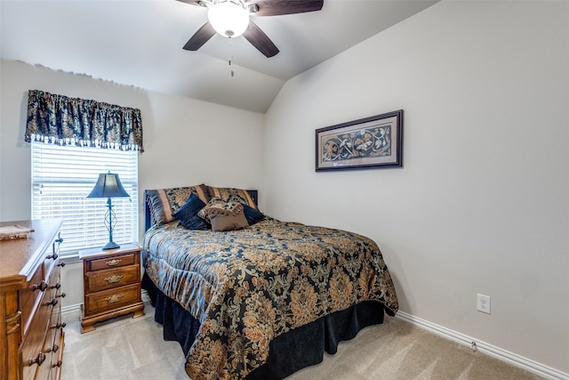 bedroom with light carpet, lofted ceiling, and baseboards