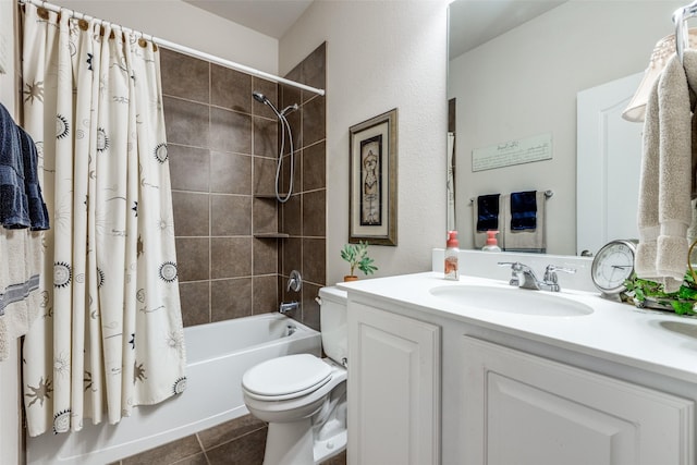 full bath with toilet, tile patterned flooring, shower / bath combo with shower curtain, and vanity