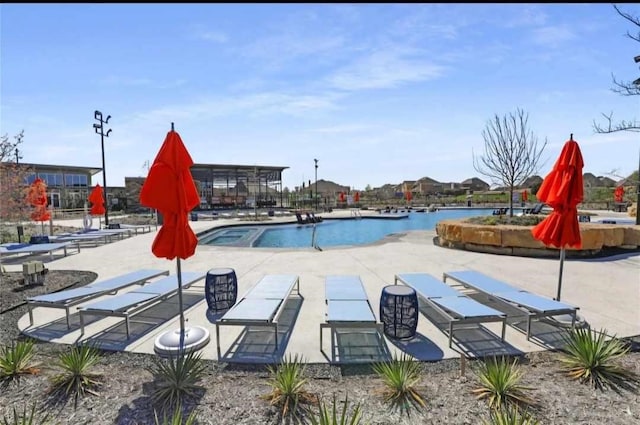 community pool featuring a patio area