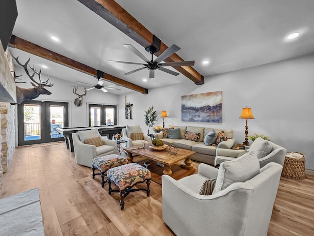 living area featuring light wood-type flooring, french doors, beam ceiling, and recessed lighting