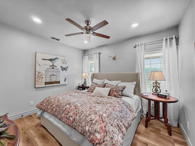 bedroom with recessed lighting, baseboards, visible vents, and light wood finished floors