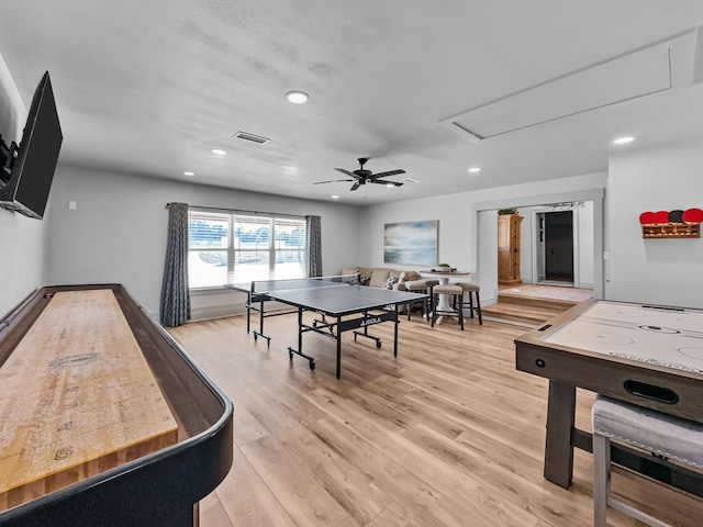 recreation room featuring attic access, recessed lighting, visible vents, and light wood-style flooring