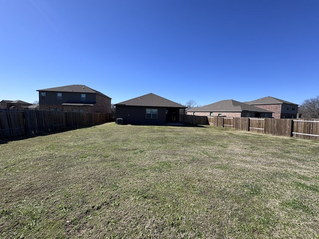 view of yard with a fenced backyard