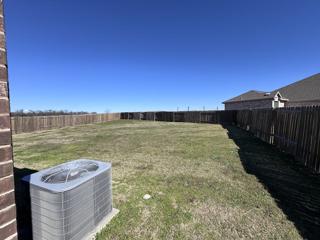 view of yard featuring a fenced backyard and cooling unit