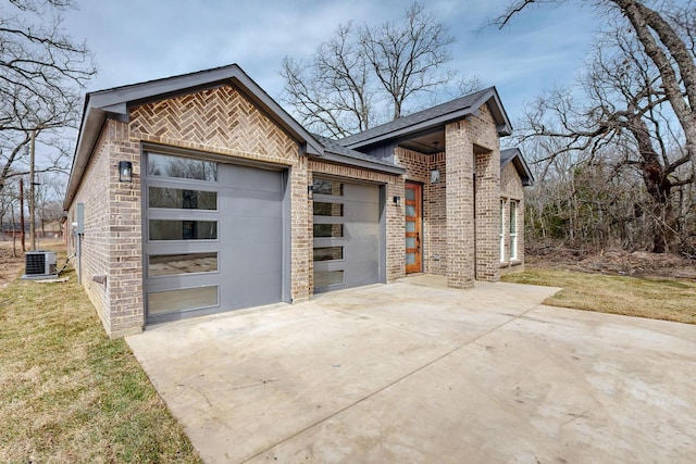 exterior space featuring driveway and central AC unit