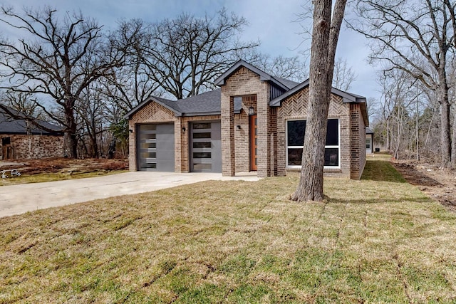 view of front of property with concrete driveway, brick siding, an attached garage, and a front yard