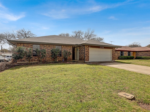 ranch-style house featuring brick siding, roof with shingles, concrete driveway, a garage, and a front lawn