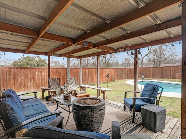 view of patio / terrace with an outdoor fire pit, a fenced in pool, and a fenced backyard