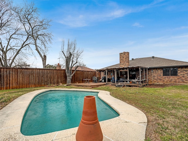 view of swimming pool featuring a yard, a patio, a fenced backyard, and a fenced in pool