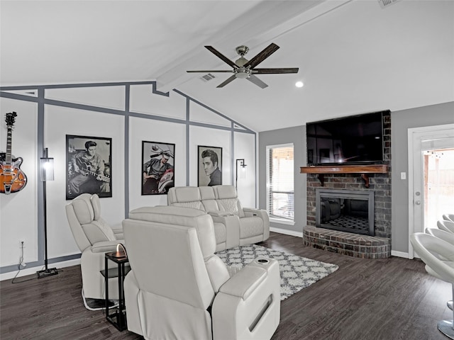 living room with vaulted ceiling with beams, plenty of natural light, a fireplace, and dark wood-style floors