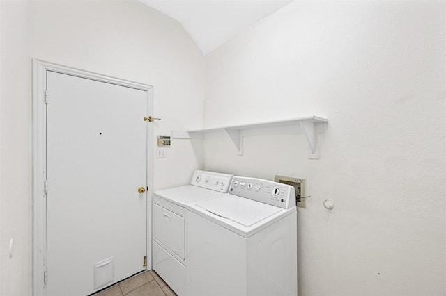 washroom with laundry area, independent washer and dryer, and light tile patterned floors