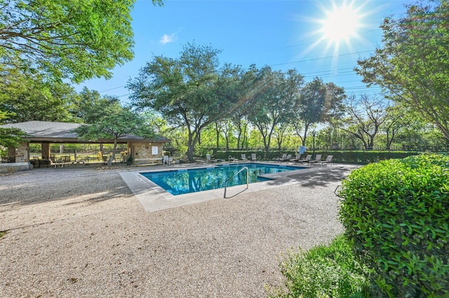 community pool featuring a patio area