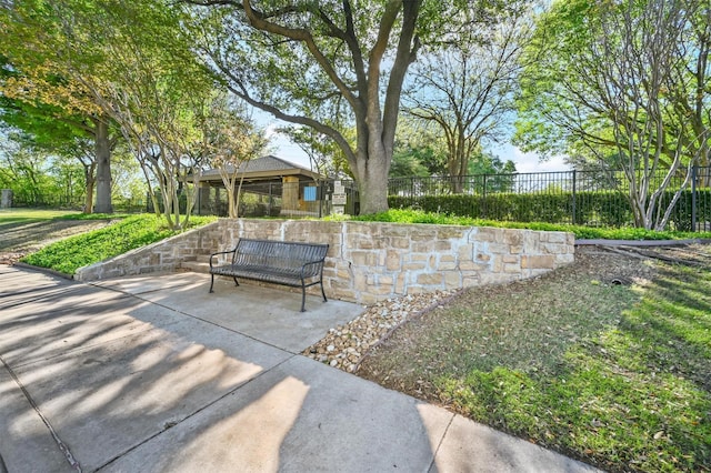 view of home's community featuring a patio area and fence