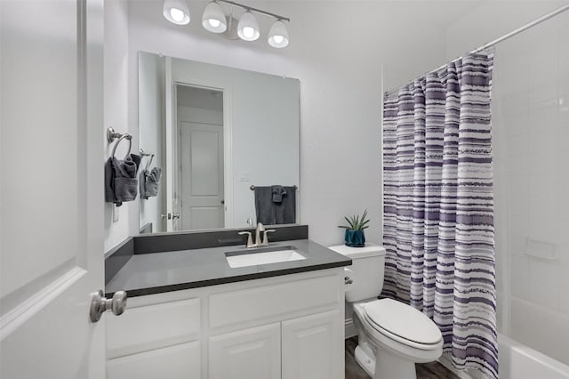 full bath with shower / bath combo with shower curtain, toilet, and vanity