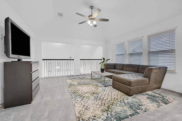 living room featuring visible vents, plenty of natural light, a ceiling fan, and carpet floors