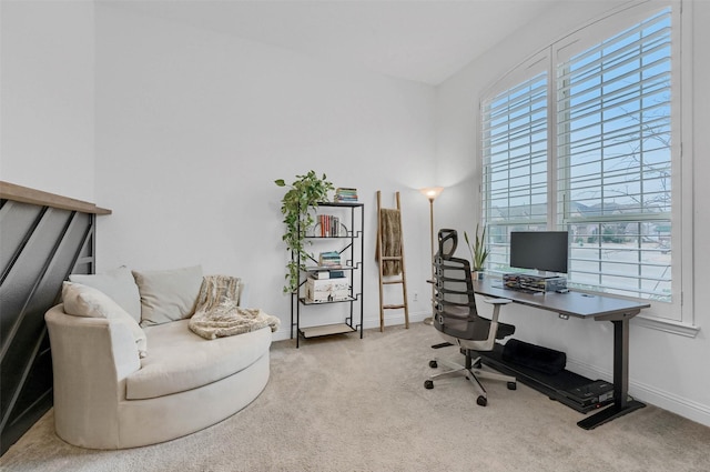 home office featuring carpet and baseboards