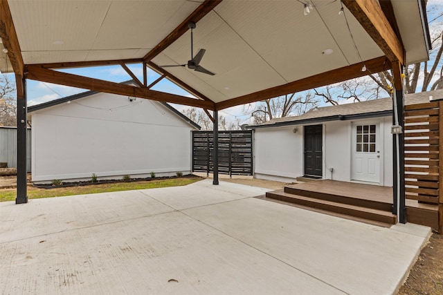 view of patio / terrace featuring ceiling fan and fence