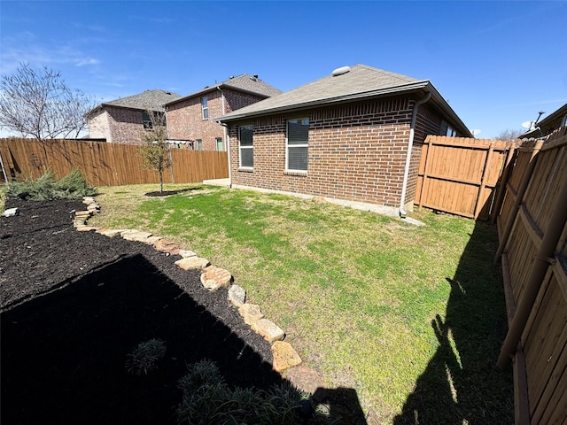 view of yard featuring a fenced backyard