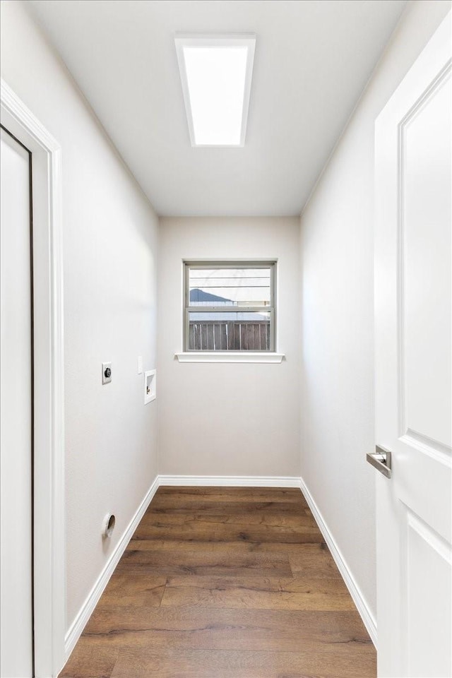 laundry room with laundry area, washer hookup, electric dryer hookup, and wood finished floors