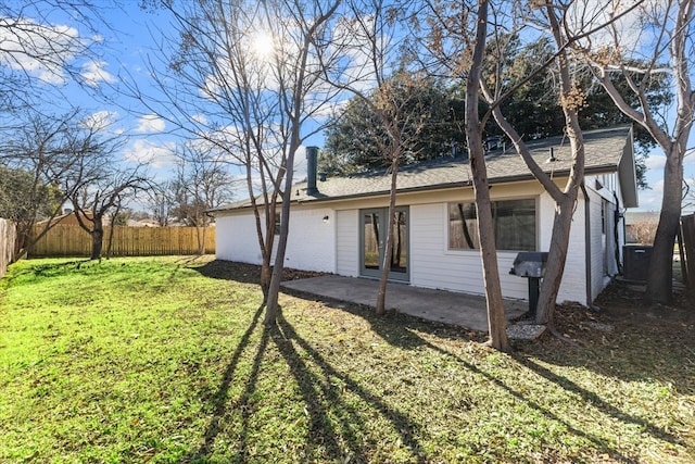 exterior space with a yard, french doors, a patio, and a fenced backyard