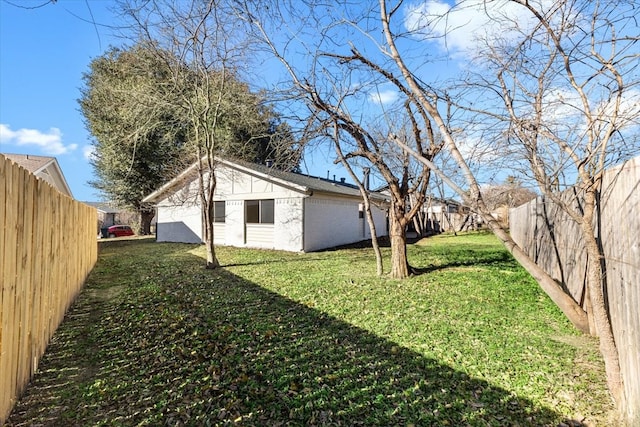 view of yard with a fenced backyard