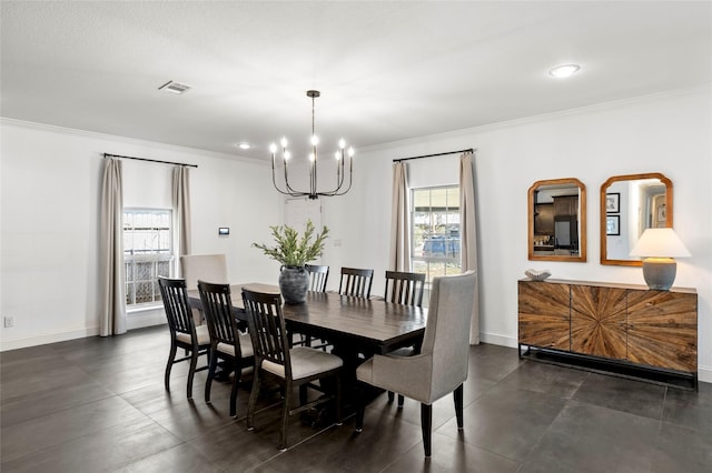 dining space with a chandelier, baseboards, visible vents, and crown molding