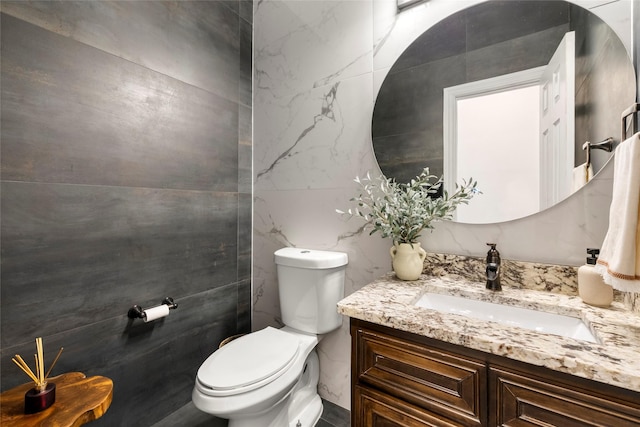 half bath featuring toilet and vanity