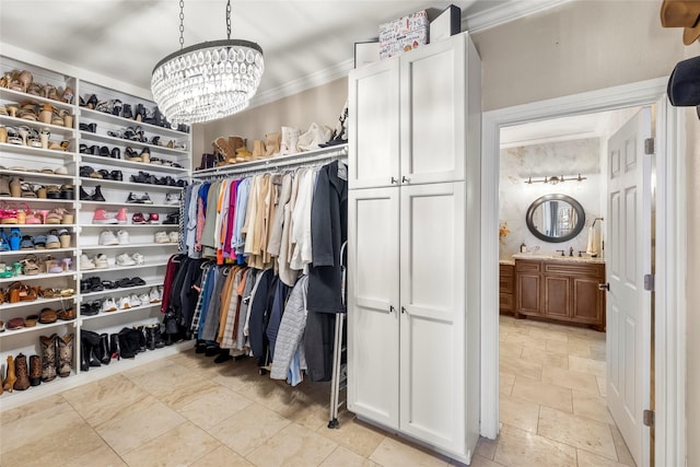 spacious closet with a notable chandelier