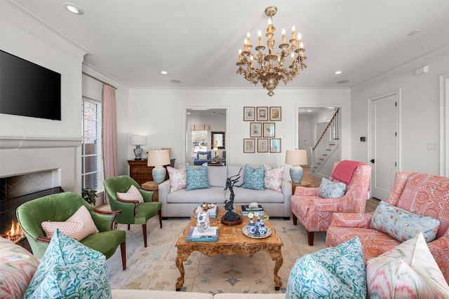 living area featuring recessed lighting, crown molding, a lit fireplace, and stairs