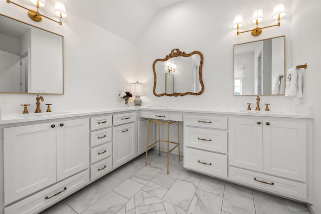 full bath featuring lofted ceiling, marble finish floor, a sink, and double vanity