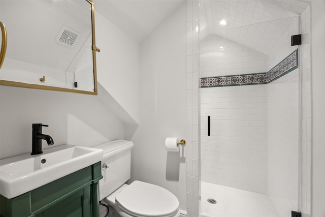 bathroom featuring a stall shower, visible vents, vaulted ceiling, and toilet