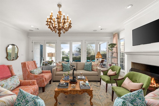 living area featuring french doors, visible vents, crown molding, and a lit fireplace