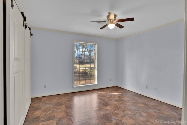 unfurnished room with baseboards, a ceiling fan, a barn door, and ornamental molding