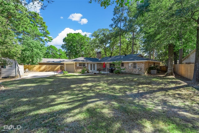 exterior space featuring a patio, an attached garage, central AC, and fence