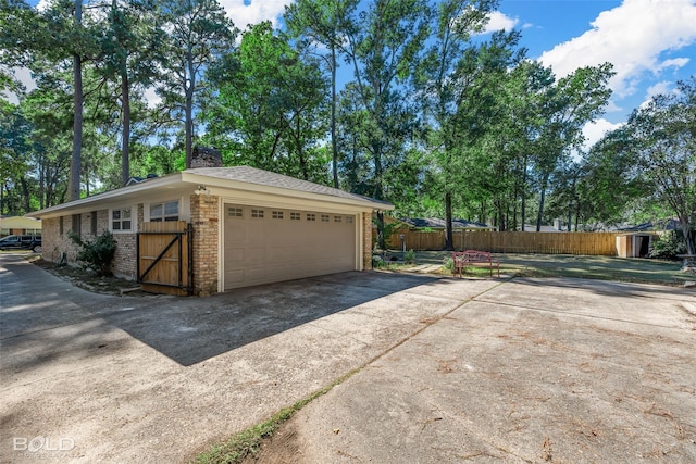 garage featuring fence