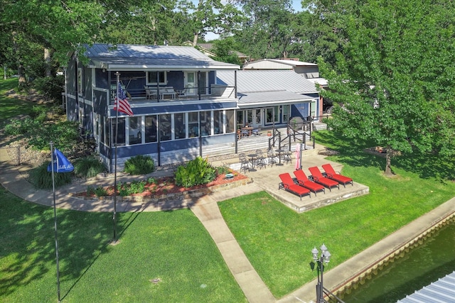 154 Bayside Cir, Malakoff, TX 75148 - rear view of property featuring a balcony, a patio, metal roof, and a yard
