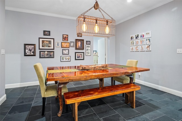 dining area with ornamental molding and baseboards