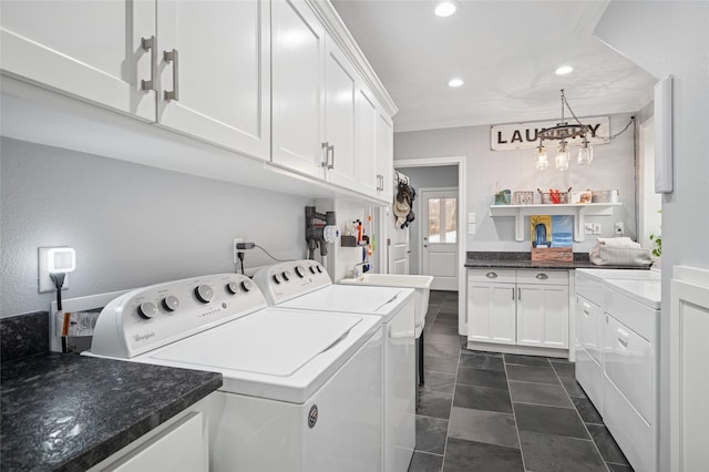 clothes washing area featuring an inviting chandelier, washing machine and clothes dryer, cabinet space, and recessed lighting